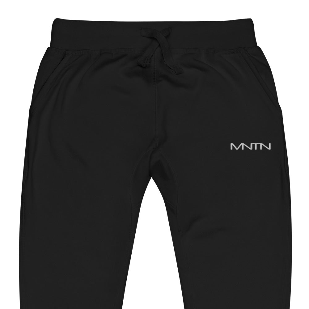 MNTN Fleece Sweatpants in Black — logo detail